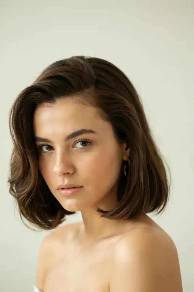 Chic Medium-Length Blowout With Deep Side Part And Flipped Ends
